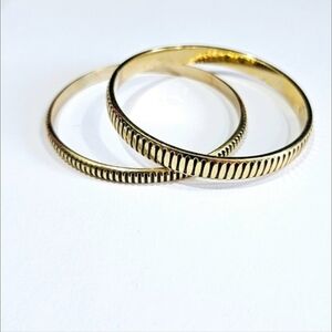 Pair of Gold and Black Bracelets